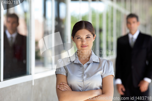 Image of Confident Businesswoman Standing Arms Crossed