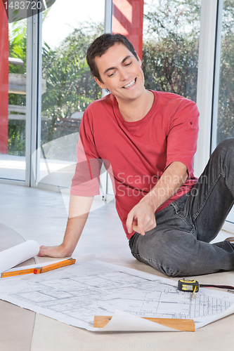 Image of Engineer pointing at blueprint
