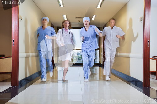 Image of Team of surgeon and nurse running