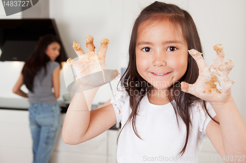 Image of Child with Cookie Dough on Hands