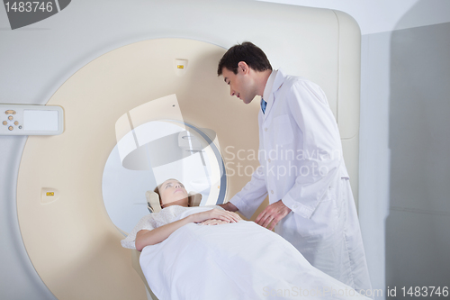 Image of Young woman receiving CT scan