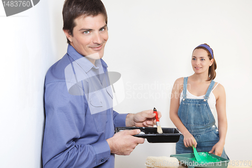 Image of Husband mixing paint