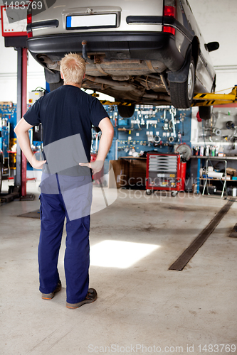 Image of Mechanic Looking at Car