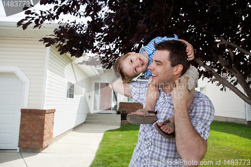 Image of Father With Little Son on His Shoulders