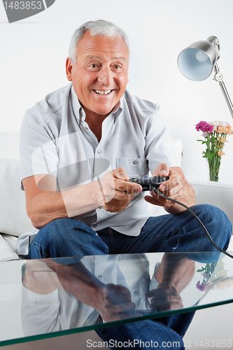 Image of Senior Man Playing Video Game