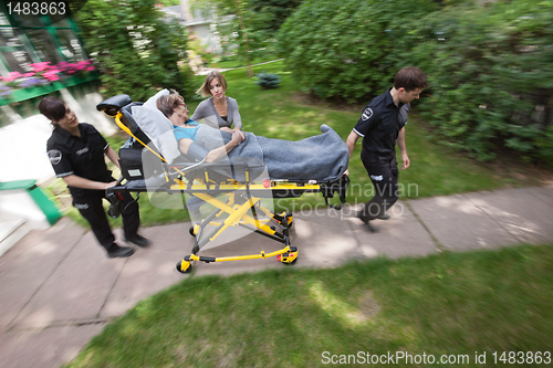 Image of Senior Woman with Emergency Medical  Help