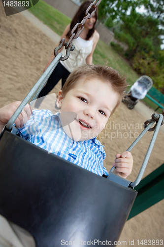 Image of Portrait of Small Boy Swinging