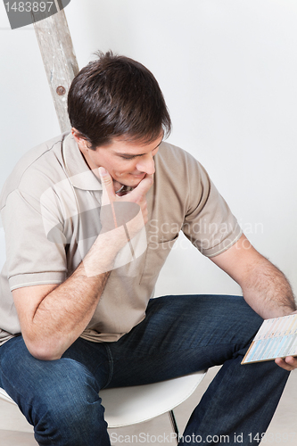 Image of Man looking at color guide