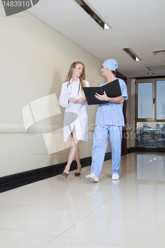 Image of Doctor and nurse reading information