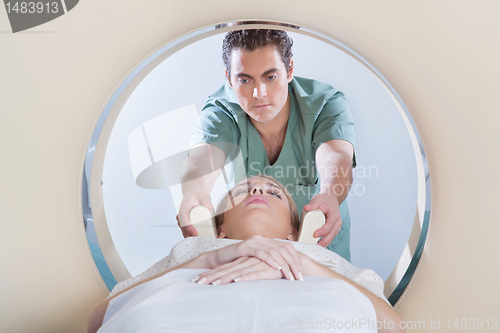 Image of Young woman going through CT test