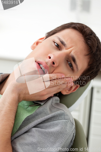 Image of Young man with a toothache