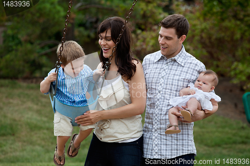 Image of Family Having Fun in Playground