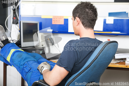 Image of Mechanic at Desk