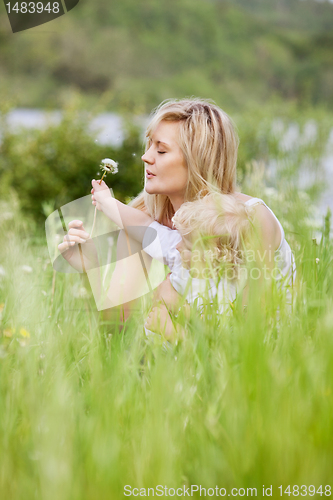 Image of Mother and Son in Meadow Making Wishes