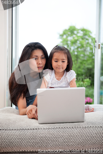 Image of Mother and daughter with laptop