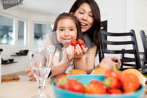 Image of Mother and Daughter in Kitchen with Strawberries