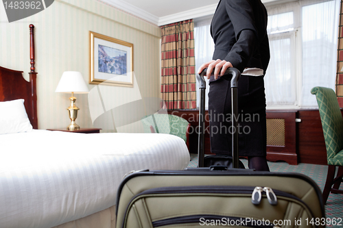 Image of Woman in Hotel Room