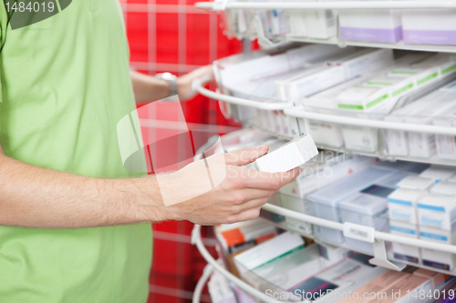 Image of Man Holding Medication Box