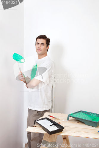 Image of Man with paint roller