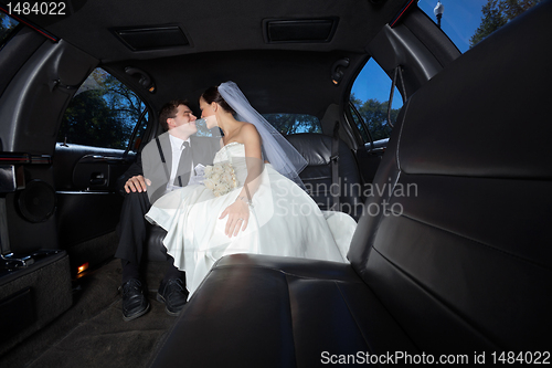 Image of Wedding Couple in Limo