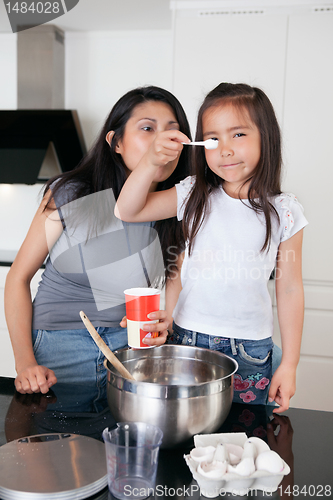 Image of Mother and daughter in kitchen