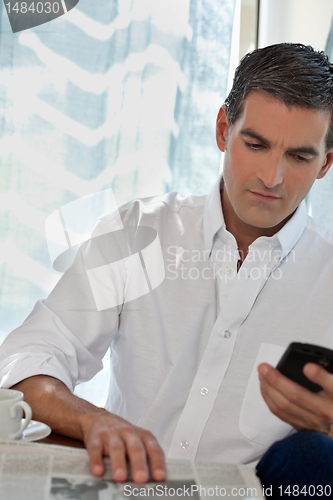 Image of Casual Man Using Cell Phone