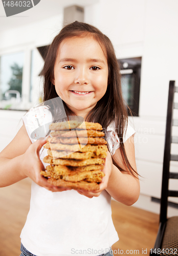 Image of Cute Girl with Fresh Cookies