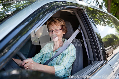 Image of Senior woman driving car