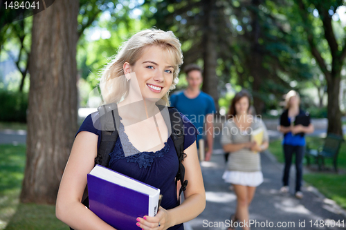 Image of Happy young college girl