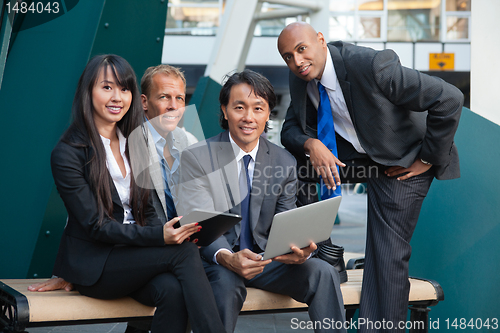 Image of Business people using electronic gadgets