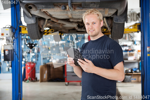 Image of Mechanic with digital tablet