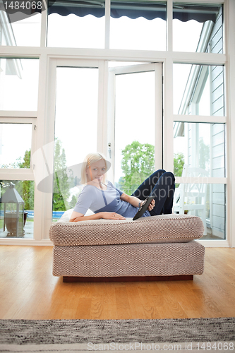 Image of Woman holding tablet-pc