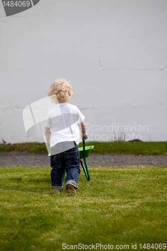 Image of Boy with Wheelbarrow