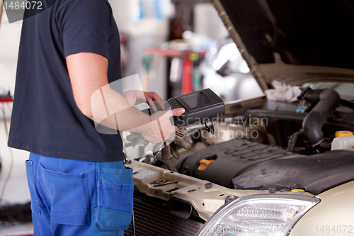 Image of Mechanic with Diagnostic Equipment