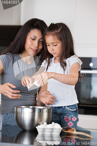 Image of Mother and Daughter Baking