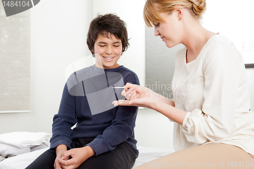 Image of Acupuncturist With Young Male Patient