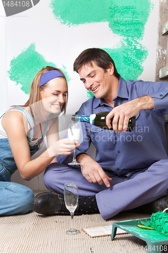 Image of Smiling couple having champagne