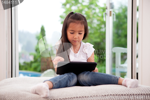 Image of Young Girl with Digital Tablet