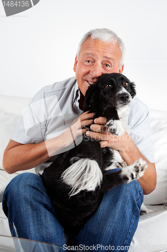 Image of Happy Senior Man With His Dog