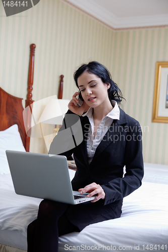 Image of Business woman Talking on Cell Phone