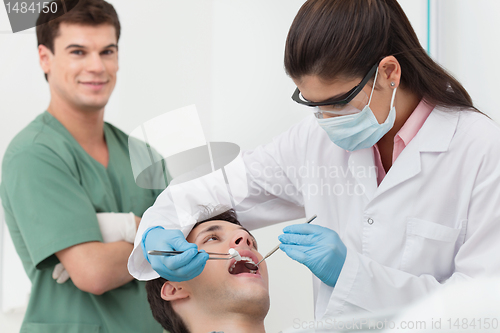 Image of Dentist procedure of cleaning teeth