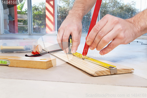 Image of Engineer marking on plywood