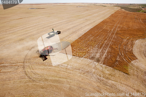 Image of Grain Cart and Combine on Prairie Field