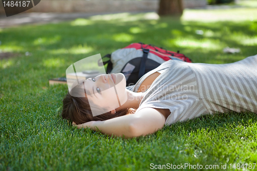 Image of Girl lying down at college campus