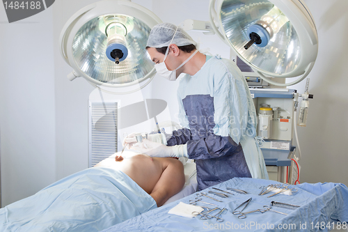 Image of Doctor performing operation