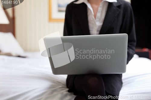 Image of Businesswoman Working on Laptop