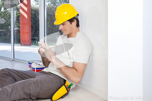 Image of Construction worker with phone