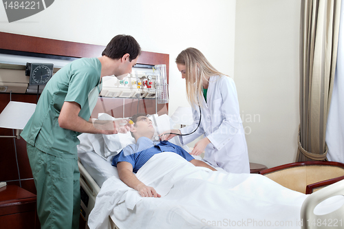 Image of Doctor examining patient