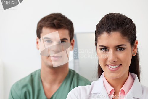 Image of Female doctor with colleague standing behind