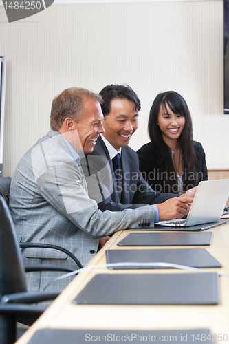 Image of Cheerful business people at work